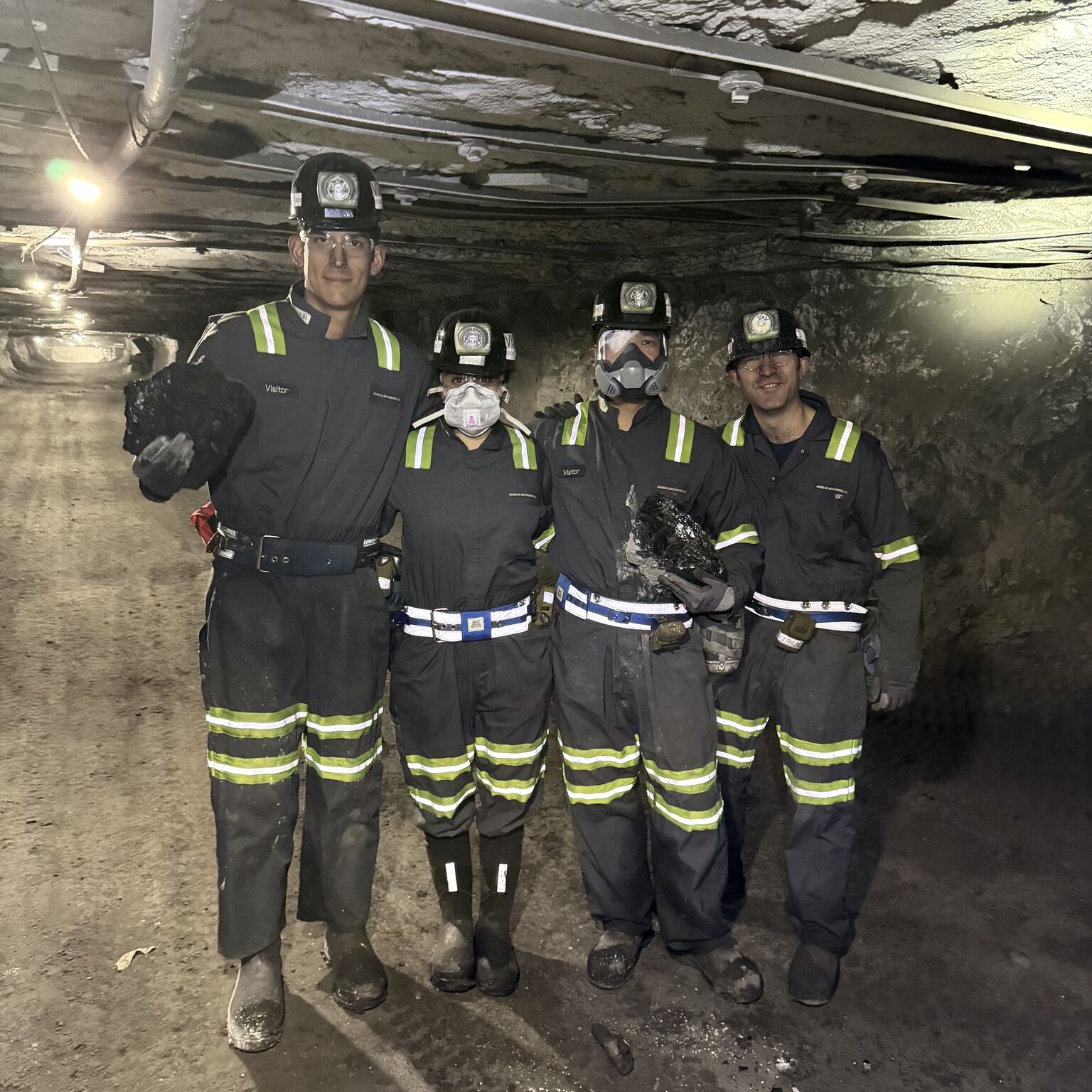 Team underground holding coal